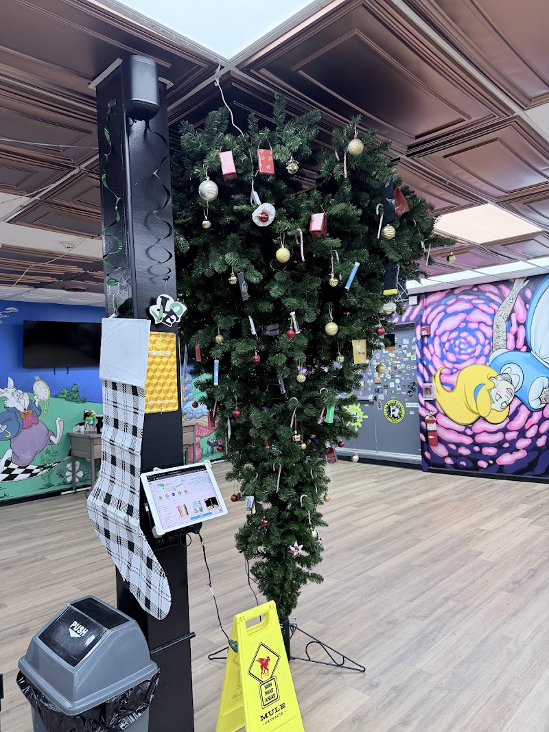 Mad Hatter Dispensary logo